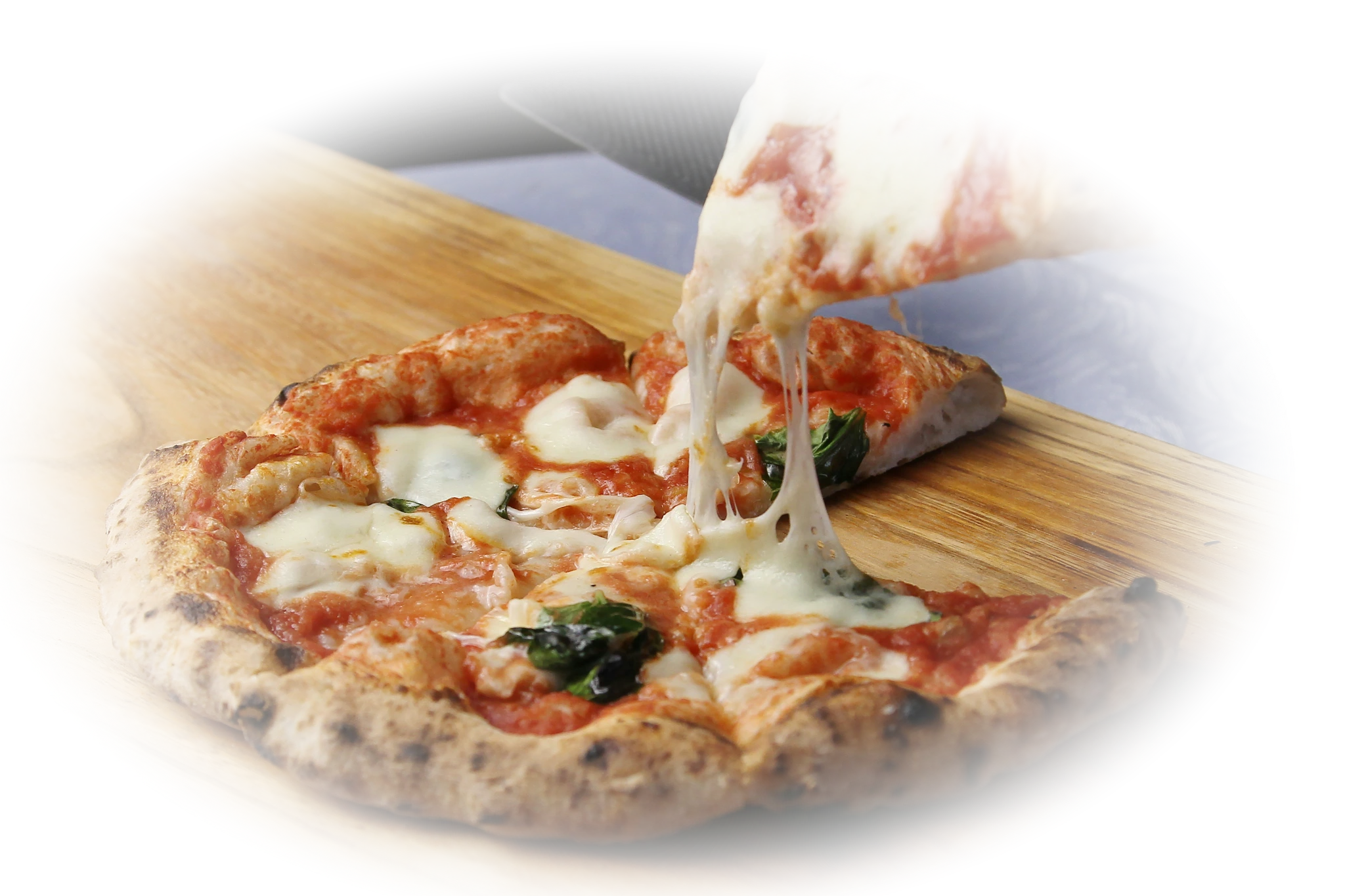 A freshly baked pizza ready to be sliced